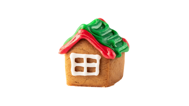 A gingerbread house with a green roof, white walls, and a white door with a red window.