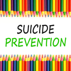 Suicide prevention symbol. Concept words Suicide prevention on beautiful white paper. Colored pencils. Beautiful white paper background. Psychological and suicide prevention concept. Copy space.