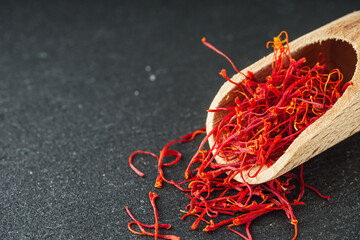 fragrant expensive spice saffron on a dark stone background