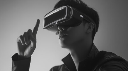 Man wearing virtual reality goggles interacting with a virtual interface against a minimalist grey background showcasing modern technology concepts
