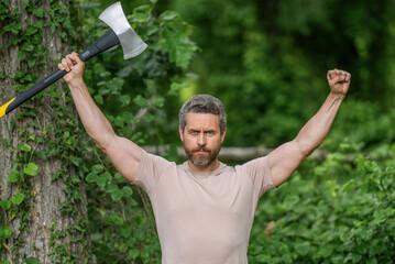 Hispanic lumberjack man with axe demonstrate success. Lumberjack axe. Man with logging axe....