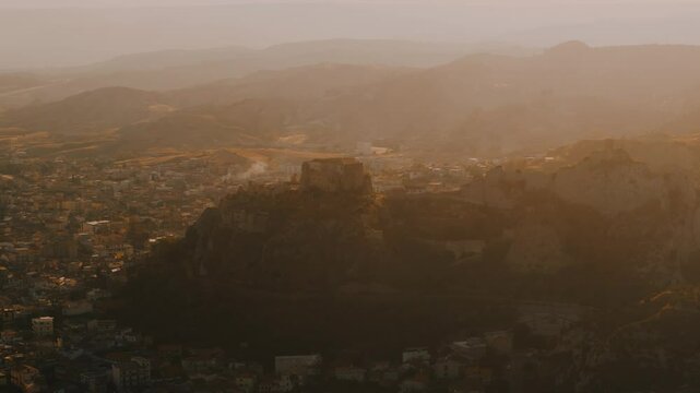 Aerial View of a Castle at  a Southern Coastal Town Roccella Ionica at Sunset