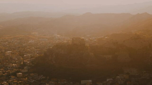 Aerial View of a Castle at  a Southern Coastal Town Roccella Ionica at Sunset