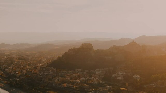 Aerial View of a Castle at  a Southern Coastal Town Roccella Ionica at Sunset