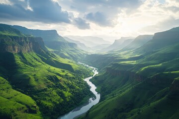 Obraz premium Serene river winding through a lush green valley.