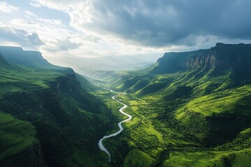 Serpentine river flows through a lush green valley.