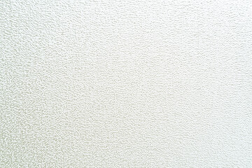 Obraz premium Creamy ivory flat texture with gentle shimmering effect, perfect for backgrounds or design projects. This subtle pattern adds elegance and sophistication to any visual