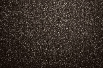 Obraz premium flat texture of dark chocolate brown with radiant speckles creates rich and inviting background. This surface adds depth and warmth to any design project