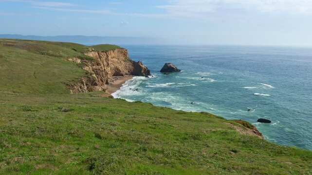 Breathtaking aerial view of Point Reyes, California, showcasing dramatic coastal cliffs surrounded by the Pacific Ocean. A stunning destination for nature lovers, photographers, and outdoor adventurer