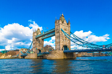 Picturesque panorama of the famous Tower Bridge over the River Thames on a sunny day with a blue...