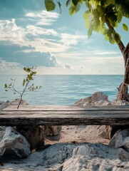 Tranquil beach scene with wooden bench and soft waves under blue sky