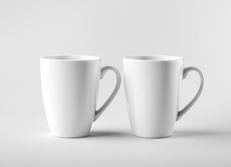 Obraz premium 2 white coffee mugs mockup, plain background, front view, no text or design on the mugs, high resolution, professional photograph, studio lighting, sharp focus, highly detailed.
