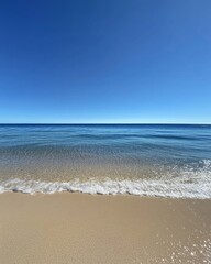 Obraz premium Tranquil beach horizon with clear sky and gentle waves