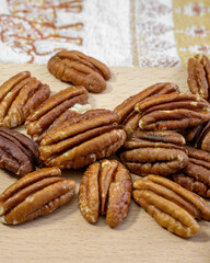 Pecan nuts on a wooden table close up