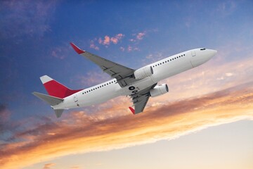 Airplane flying at beautiful blue sky
