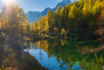 autumnal mountain landscape with a small lake inside the Alpe Devero, Val D'Ossola, Verbania, Italia	