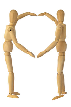 Wooden mannequins showing heart sign isolated on white background.