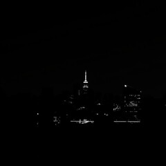 A vibrant city skyline silhouette at sunset featuring colorful hues of pink purple and orange creating a stunning urban landscape silhouetted skyline cityscape architecture illustration building city 