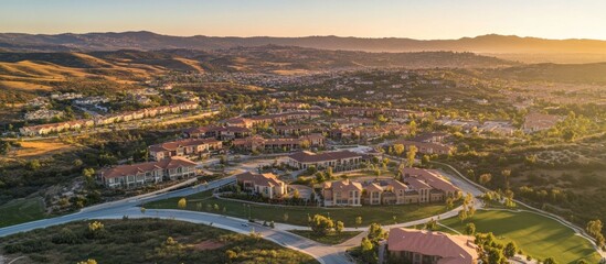 Fototapeta premium Aerial Sunset View Hillside Homes, Golden Hour