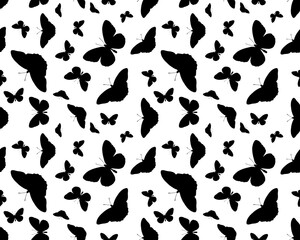 Seamless pattern with black silhouettes of butterflies on white