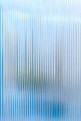 Obraz premium Abstract background with reeded ribbed glass effect texture