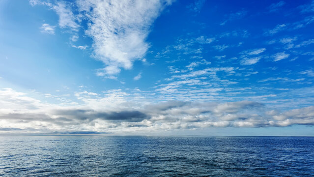 Seascape with Blue Sky and Wispy Cirrus Clouds.
