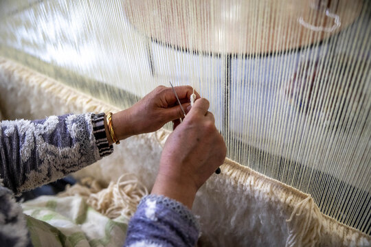 Carpet weaver at work in Azrou, Morocco