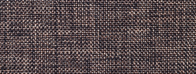 Texture dark brown background woven textile material with wicker pattern, macro. Structure vintage umber fabric cloth