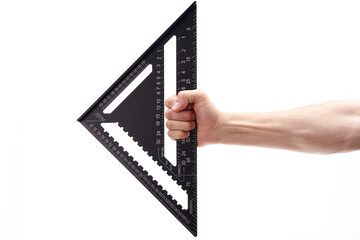 A carpenter's black square in his hand on a white background