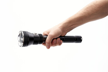 black flashlight in hand on a white background
