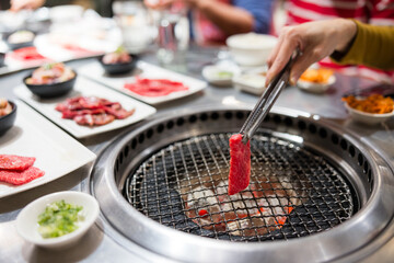 Traditional Japanese barbecue yakiniku with grilling meat