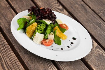 Tasty healthy fresh salad bowl with ingredients.