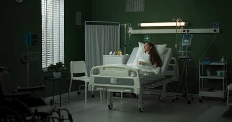 Doctor stands, explaining the X-ray results on a tablet to the patient.