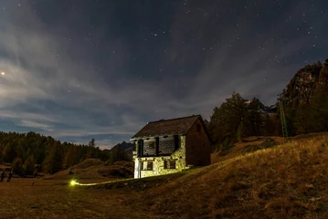Fotobehang Chocoladebruin night shots of an autumnal mountain landscape inside the Alpe Devero, Val D'Ossola, Verbania, Italia    © fruttuoso