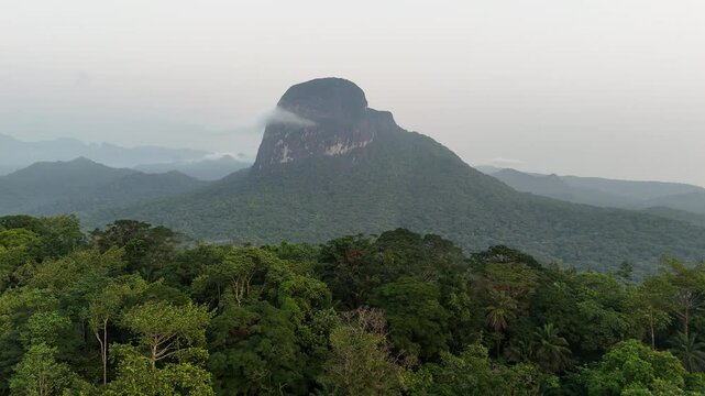 Sao Tome and Principe - Aerial View of Pico Maria Fernandes. Majestic Volcanic Mountain Rising Above Dense Tropical Rainforest Near Angolares.