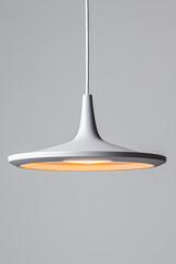 Fototapeta premium A modern grey pendant light hanging isolated on grey background