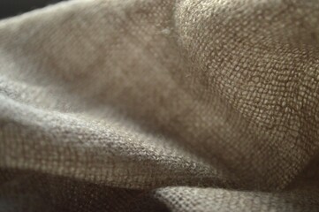 Close-up of Textured Linen Fabric, Showing its Natural Fibers and Subtle Color Variations