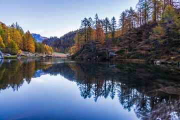 autumnal mountain landscape with a small lake inside the Alpe Devero, Val D'Ossola, Verbania, Italia	