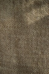 Detailed view of burlap's coarse texture, showing its natural fibers and rustic look.
