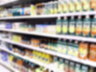 Abstract blur image of supermarket background. Retail industry. Shopping. Grocery store. Shelves with products. Cpg. Super mart. Health Tech. Inflation and crisis concept. Aisle. Food coloring bans.
