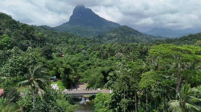 Sao Tome and Principe - Angra Toldo Praia and Pico Maria Fernandes. Scenic Small Town Surrounded by Tropical Rainforest and Majestic Mountains.