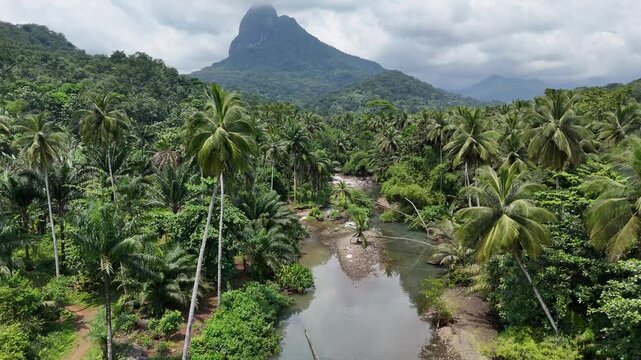 Sao Tome and Principe - Angra Toldo Praia and Pico Maria Fernandes. Scenic Small Town Surrounded by Tropical Rainforest and Majestic Mountains.
