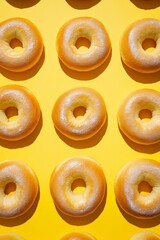 Golden Brown Bagels on Vibrant Yellow Background, Close Up with Shadows, Ideal for Food, Bakery or Breakfast Themes