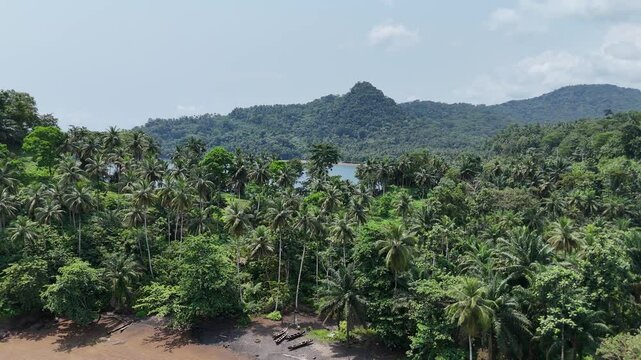 Sao Tome and Principe - Angra Toldo Praia and Pico Maria Fernandes. Scenic Small Town Surrounded by Tropical Rainforest and Majestic Mountains.