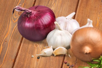 Garlic cloves on wooden table.