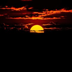 Obraz premium Artistic city skyline with key silhouette under radiant sunset design silhouetted skyline cityscape architecture illustration building city vector