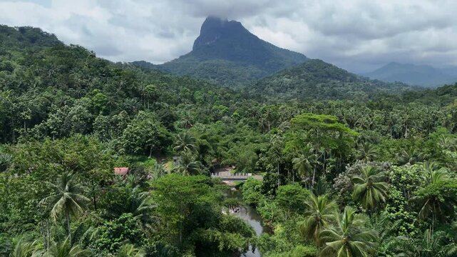 Sao Tome and Principe - Angra Toldo Praia and Pico Maria Fernandes. Scenic Small Town Surrounded by Tropical Rainforest and Majestic Mountains.