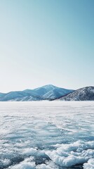 Frozen hokkaido lake rippling ice and distant mountains