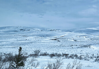 Clouds casting shadows on snow on the Denali Highway