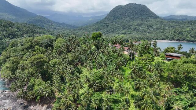 Sao Tome and Principe - Angra Toldo Praia and Pico Maria Fernandes. Scenic Small Town Surrounded by Tropical Rainforest and Majestic Mountains.